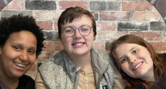photo of Lukas between his siblings