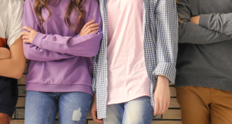 closeup photo of six young people's torsos standing together