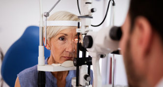 Optometrist measuring patient's vision