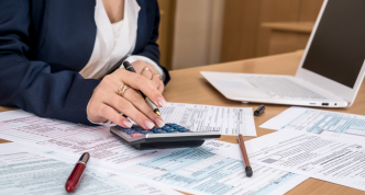 Photo of a person handling printed forms