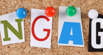the word Engage in cut out magazine letters pinned to a cork notice board