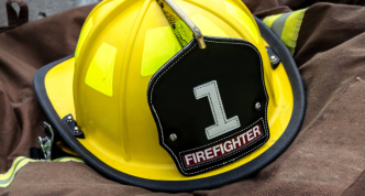 firefighting helmet lying on a turnout coat