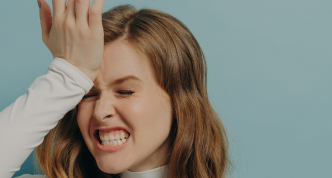 frustrated woman with hand on forehead