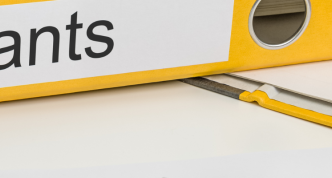 grants binder close up on desk