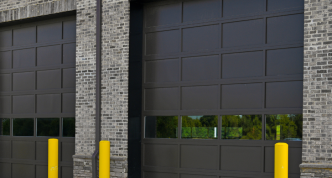 three truck bay doors of a highway garage