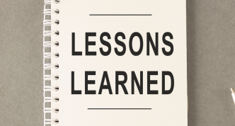 lessons learned concept written on notebook
