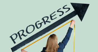 woman measuring "progress" with tape measure