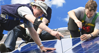 men installing rooftop solar