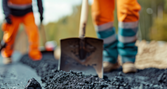 highway workers constructing asphalt pavement