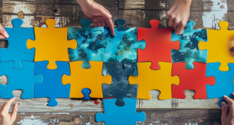 hands building a puzzle together