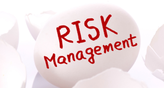 Risk management. Egg and broken egg shells on white background.