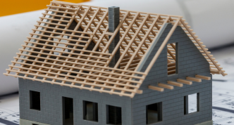 unfinished house sitting on development plans