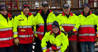 Woodstock firefighters accompany their department’s antique fire engine during Wassail Weekend 2025