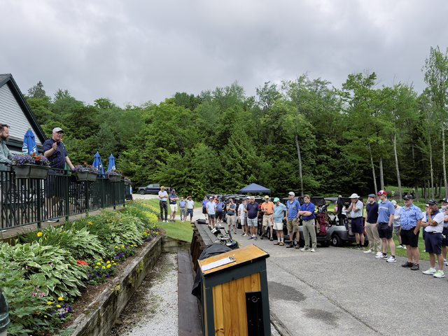 Golfers near their carts before the start