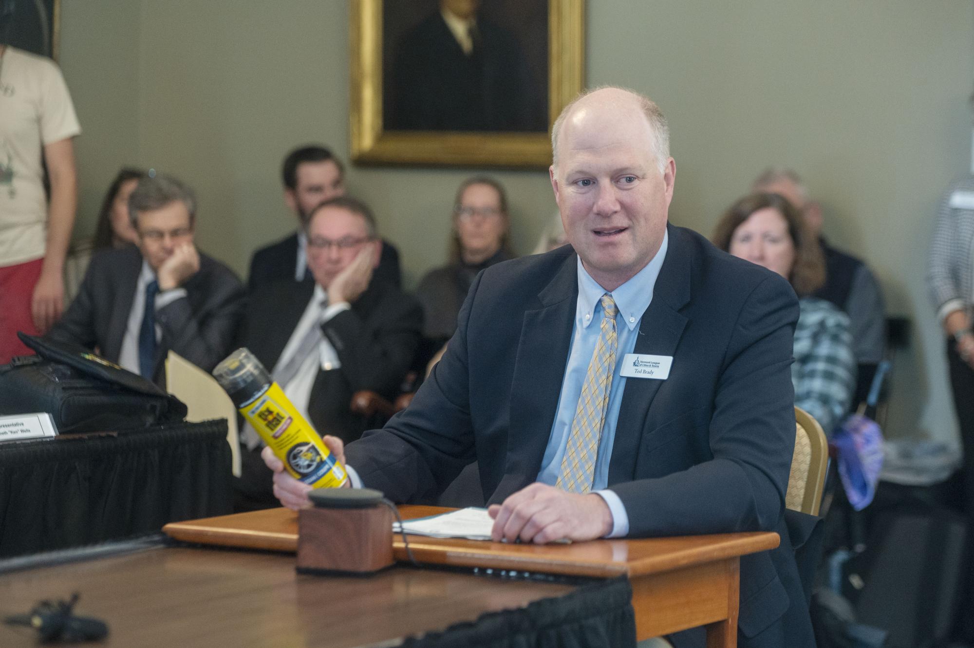 photo of Ted Brady holding a can of Fix-A-Flat while testifying on April 23, 2026